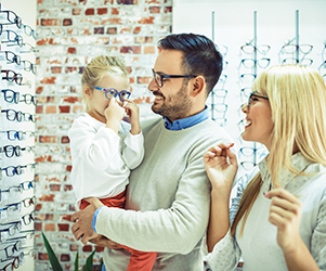 Family choosing glasses